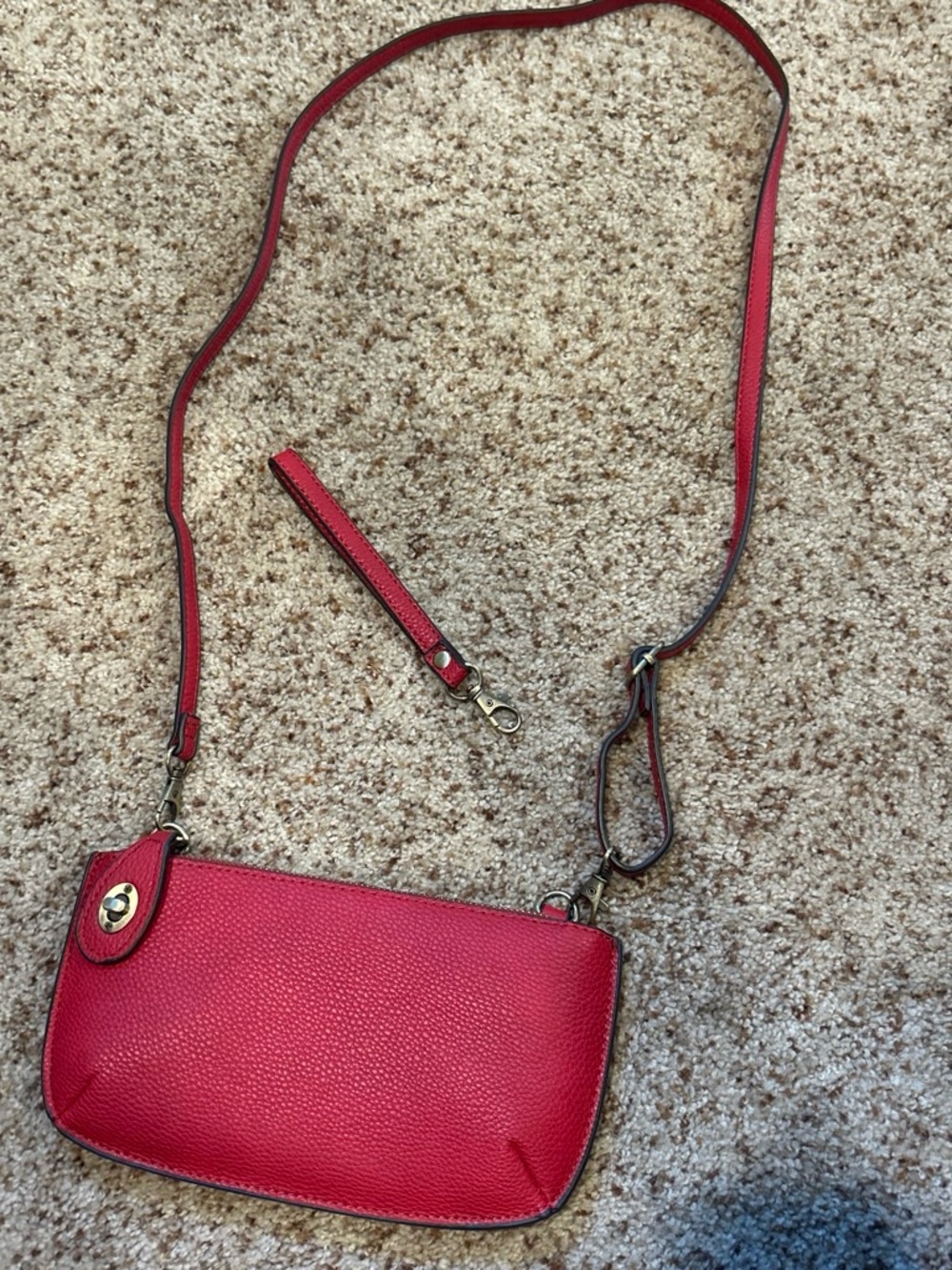 Compact Red Pebbled Leather Crossbody Bag with Adjustable Strap